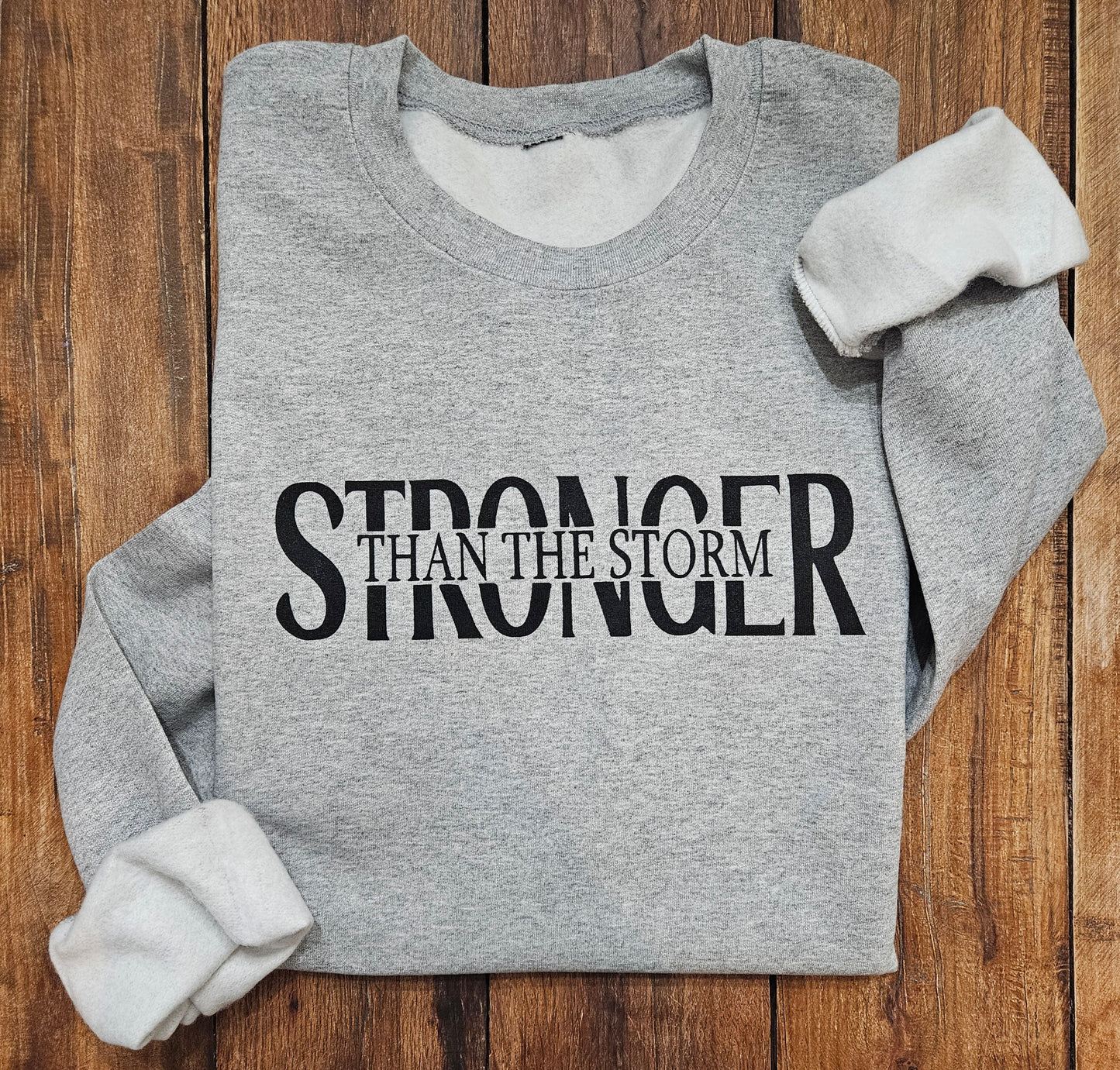 Stronger Than The Storm Sweatshirt (Adult)